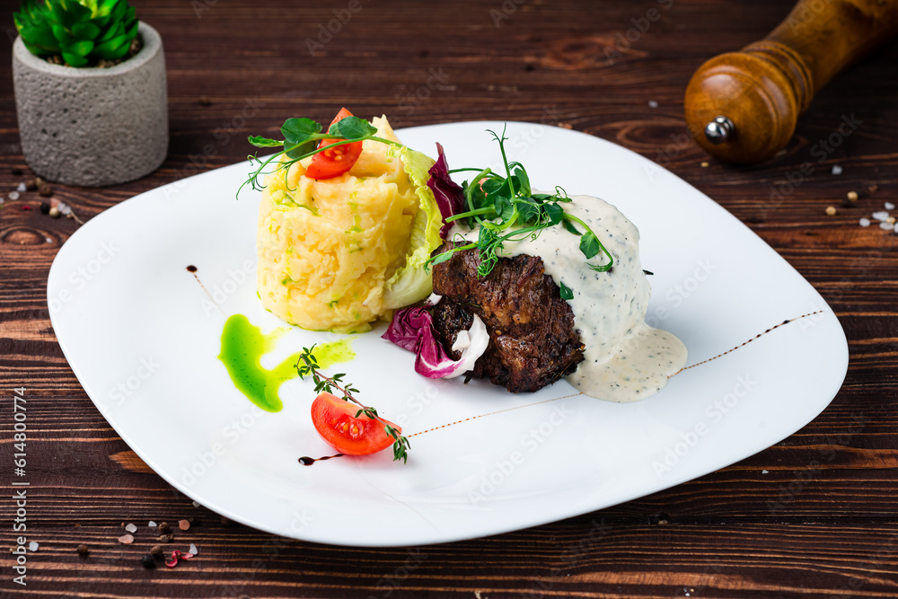 Canvas Prints beef steak with mashed potatoes, tomatoes, lettuce, herbs and sauce, fresh lunch.