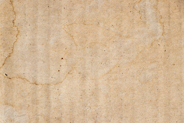 Water stained on brown corrugated packaging material background. Use as texture or layer decoaration