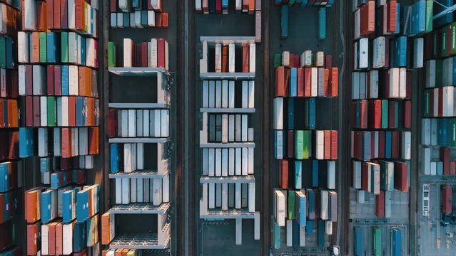 Container terminal port aerial topdown. Aerial top view footage of container terminal. Industrial cargo port. Logistic center. Industrial cargo port. 