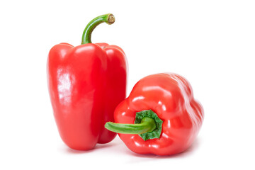 Two Fresh Red Sweet Bell Peppers Isolated on White Background