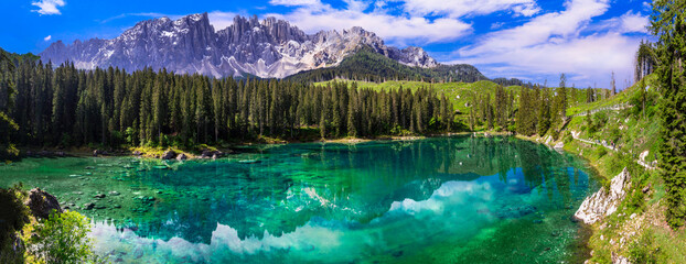 Idyllic nature scenery- turquoise mountain lake Carezza surrounded by Dolomites rocks- one of the most beautiful lakes of Alps. South Tyrol region. Italy