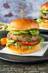 Plantain and black bean burger in brioche bun