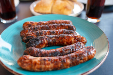 Grilled sausages on a plate. Traditional german bratwurst