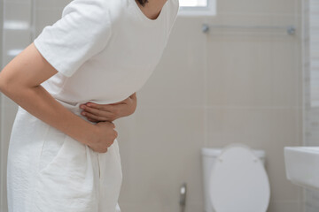 stomach ache. Asian women have abdominal pain, indigestion, gastritis, menstrual cramps, flatulence, diarrhea, distention, colon cancer, belly inflammation problem, suffer food poisoning, abdomen