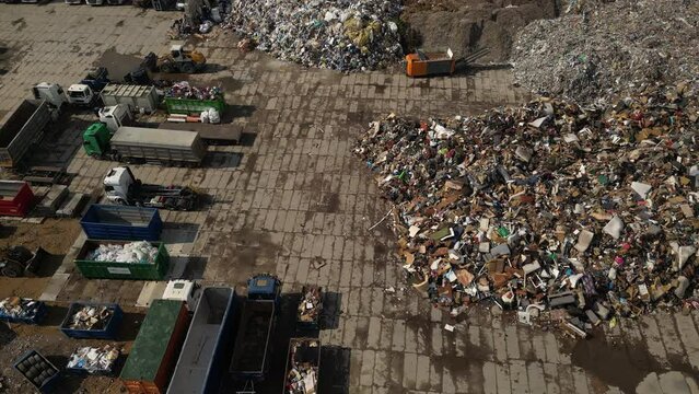 Aerial top down view of large garbage landfill, trash dump. The concept of pollution and excessive consumption. Ecology problem, nature pollution. Top down aerial image of a Municipal Solid waste. 