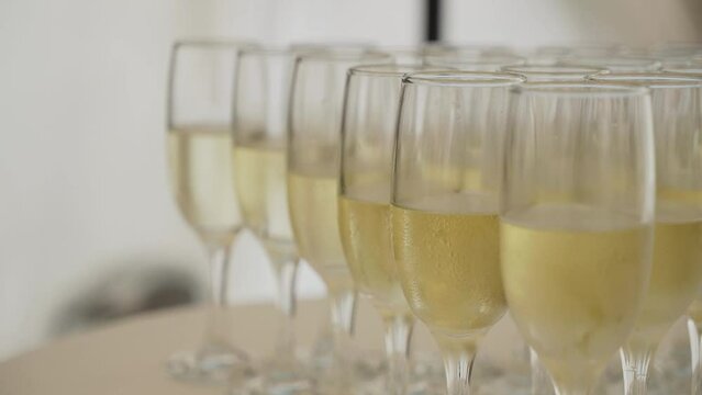 Beautiful glasses of champagne are on the table for guests