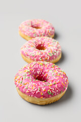 Sweet donuts on grey background