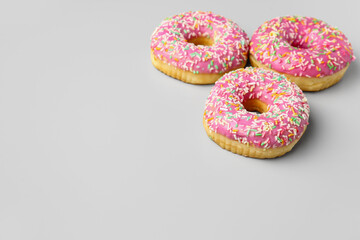 Sweet donuts on grey background