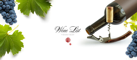 Bottle of wine with wineglass, corkscrew and bunch of grapes on a white background. Panoramic top...