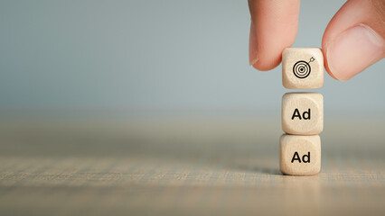 Target advertising online to success concept. programmatic Ad in feed on screen. Optimize advertisement target click through rate and conversion on wooden cube with gray background.
