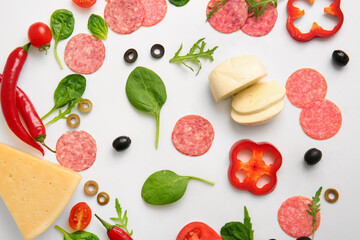Fresh ingredients for preparing pizza on white background
