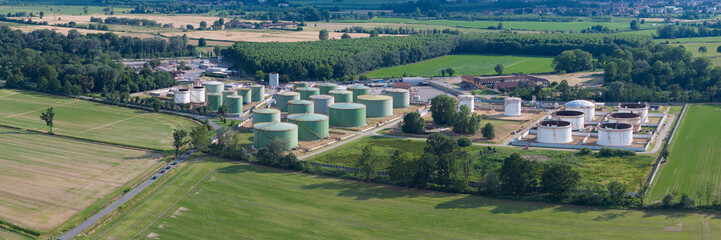 Fototapeta na wymiar Oil refinery plant at sunny day.Ecosystem and healthy environment concepts. Lacchiarella, Italy