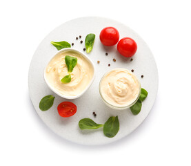 Bowls with tasty cream cheese on white background