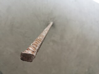 Steel bars protruding from the cement floor