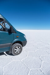 Fototapeta na wymiar Campervan 4x4 in a Uyuni Salt Flats.