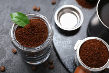 Jar with coffee powder on black background