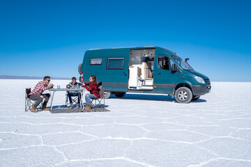 Van life family camping in a salt flat