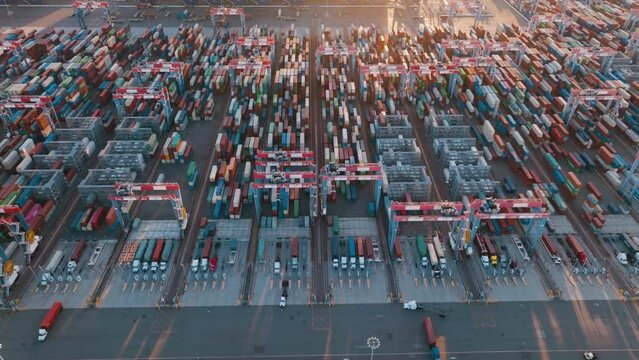 Cargo containers in busy port. Aerial view container ship carrying container in import export business logistic and transportation. Commercial port with container ship. 