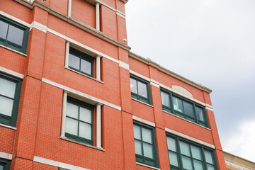 Brick buildings: icons of stability, progress, and community. Offices and apartment complexes symbolize growth, urban living, and shared aspirations