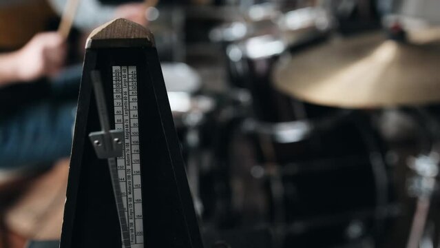 Mechanical metronome for music rhythm and tact measuring in music school with drums. Classical tool for musicians and song creators