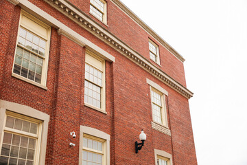 Brick buildings: icons of stability, progress, and community. Offices and apartment complexes symbolize growth, urban living, and shared aspirations