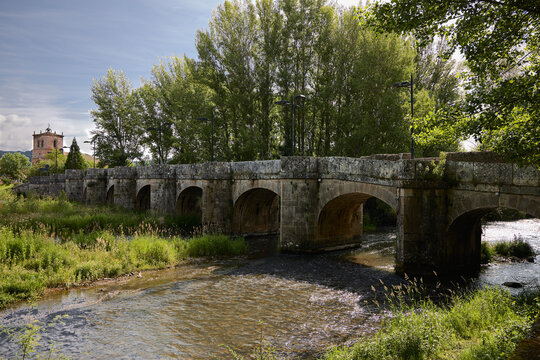 Cervera de Pisuerga (Spain), June 13, 2023. Bridge over the Pisuerga river. This is a small town in the province of Palencia, belonging to the Community of Castilla y Le&oacute;n.