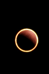 Annular solar eclipse observed from the earth phenomenon in which the moon is between planet earth and star sun forming the ring of fire