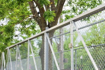 chain linked fence, symbolizing confinement, barriers, and restrictions, captures the essence of limited freedom and separation