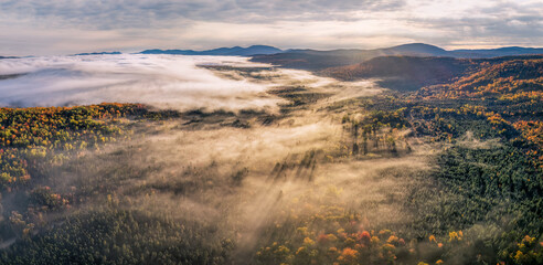 Sunrise fog on the Rangeley Lakes Scenic Byway - autumn scenic drive - Maine 