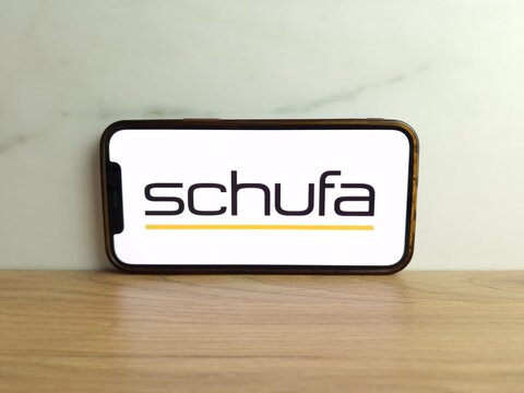 Konskie, Poland - June 17, 2023: Schufa German private credit bureau logo displayed on mobile phone screen