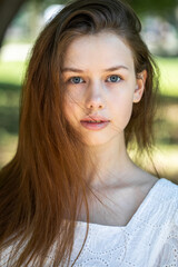 Obraz premium Portrait of a young tenager girl, summer park outdoors