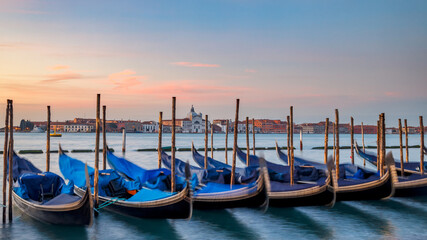 Fototapeta na wymiar Gondolas of Venice at sunrise, Italy, Europe.