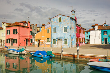 Fototapeta na wymiar The Burano island near Venice, a canal with colorful houses, Italy, Europe.