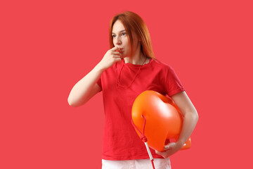 Female lifeguard with rescue buoy whistling on red background