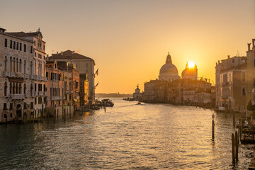 Naklejka premium The Grand Canal in Venice with the Santa Maria della Salute basilica at a beautiful sunrise, Italy, Europe.