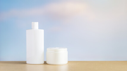 Cosmetic cream and a jar with the sky in the background