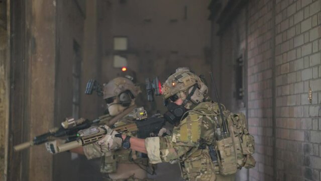 Soldier in anti-terrorist warfare in a dark building, Anti-terrorist operation training on the battlefield