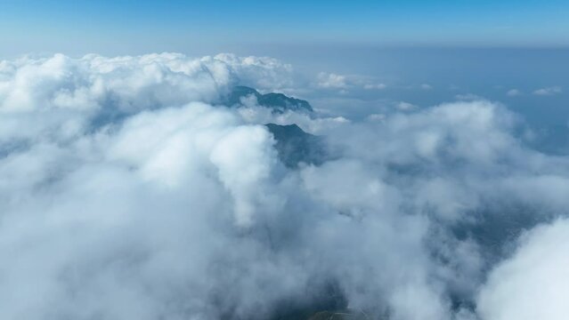 Aerial shot of low clouds moving pass mountains in Taiwan