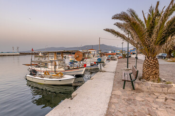 Fototapeta na wymiar Greek Fishing boats harbor scene