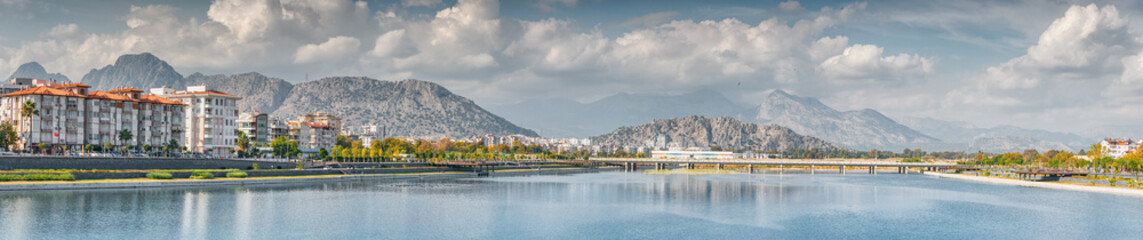 Panoramic cityscape view of Antalya resort town, Liman and Hurma district and Taurus mountains in the background