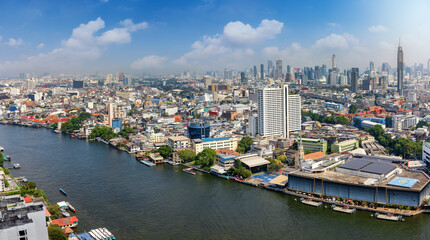 Fototapeta na wymiar Panoramic view of the skyline of Bangkok, Bang Rak and Wang Mai district, Thailand, along the Chao Phraya river