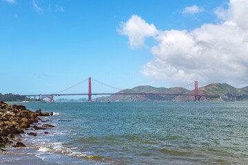 Panorama of the Golden Gate Bridge in full, San Francisco California. Golden gate bridge panorama at day. Golden Gate Bridge in San Francisco on a sunny cloudy day