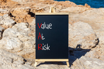 VAR Value at risk symbol. Concept words VAR Value at risk on beautiful black chalk blackboard....