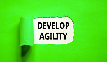 Develop agility symbol. Concept words Develop agility on beautiful white paper on a beautiful green background. Business, support and develop agility concept. Copy space.