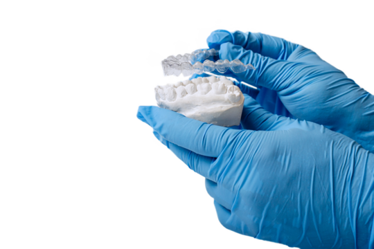 Orthodontic dental theme on blue background.Transparent invisible dental aligners or braces aplicable for an orthodontic dental treatment