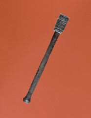 wooden torch isolated on orange background