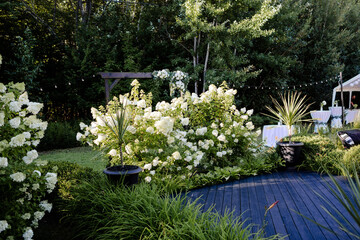Backyard wedding flowers and decor set up during summer.