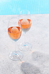 Refreshing rose wine by the pool on a sunny day