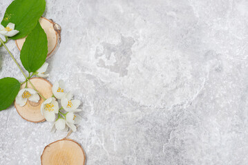 Jasmine on a marble table, light background