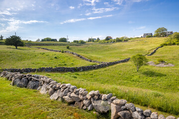 A landscape of stone walls zig zags across fields and meadows on the rolling hills of Block Island, Rhode Island, USA